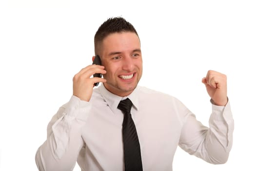 The photo shows a young businessman who is apparently cheering on the phone.