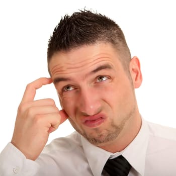 Portrait photo of a very thinking young businessman looking up.