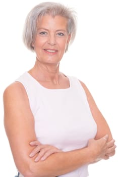 Smiling senior woman in front of white background