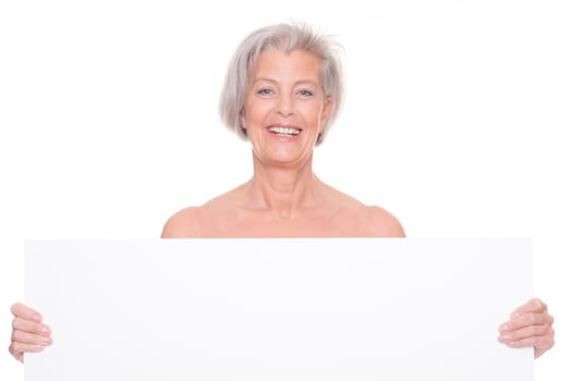 Senior woman holding billboard against white background