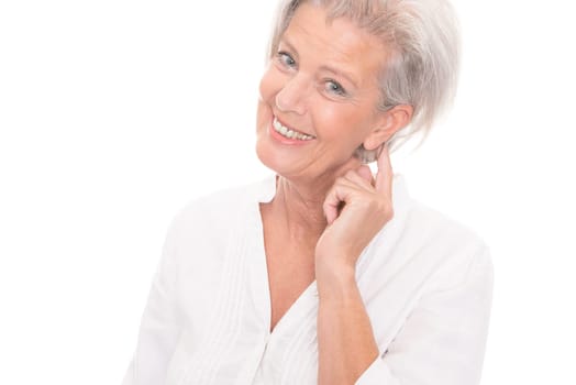 Portrait of an elderly woman against a white background