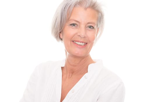 Portrait of an elderly woman against a white background