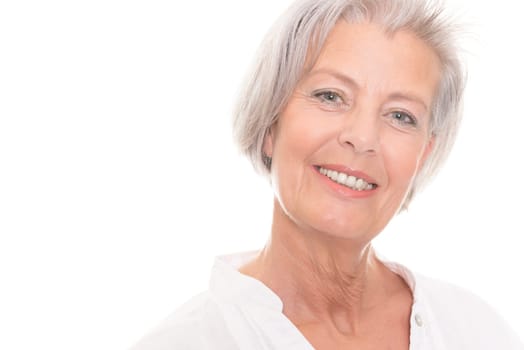 Portrait of an elderly woman against a white background