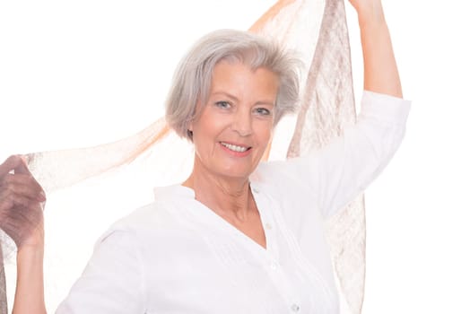 Happy senior woman with a cloth against a white background