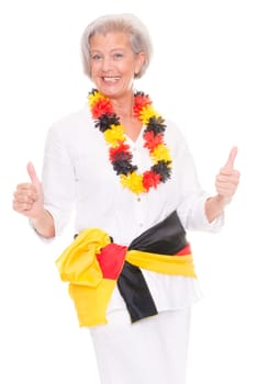 Senior woman as a German football fan in front of white background