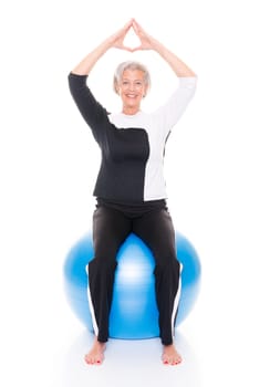 Active senior woman doing sports in front of white background
