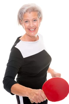 Active senior woman doing sports in front of white background