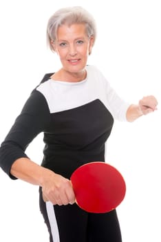 Active senior woman doing sports in front of white background