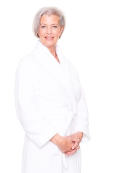 Studio shot of an elderly woman in a white bathrobe