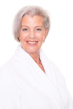 Studio shot of an elderly woman in a white bathrobe