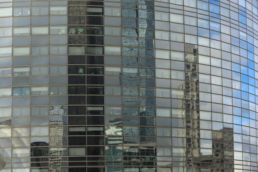 refection glasses from an office city building