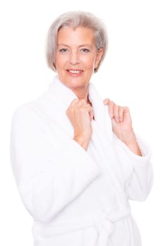 Studio shot of an elderly woman in a white bathrobe