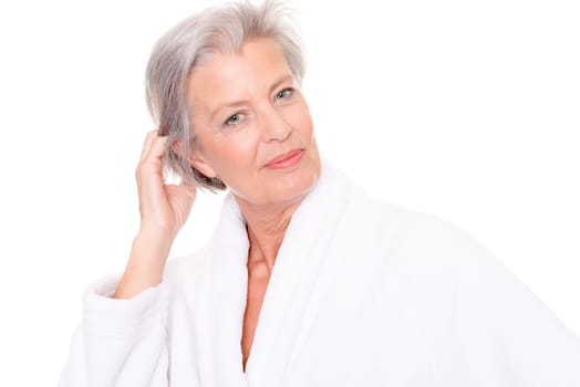 Studio shot of an elderly woman in a white bathrobe