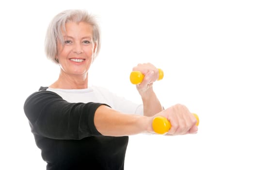 Active senior woman doing sports in front of white background