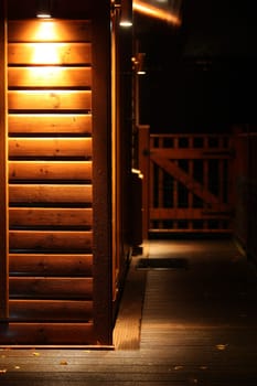 Spot light lodge at night with space for sign