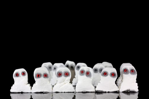 Evil white ghosts in a crowd with black space