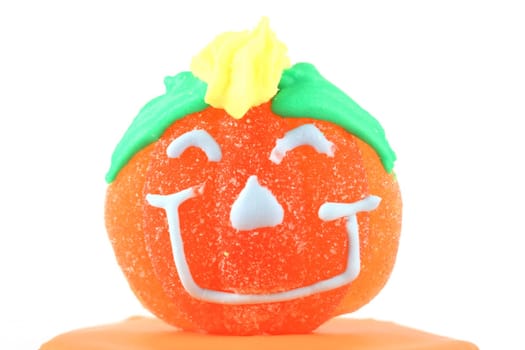 Halloween pimpkin sweet with smile on white background
