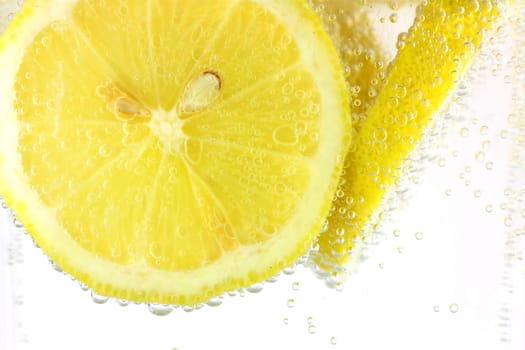 Sliced lemon in refreshing fizzy water