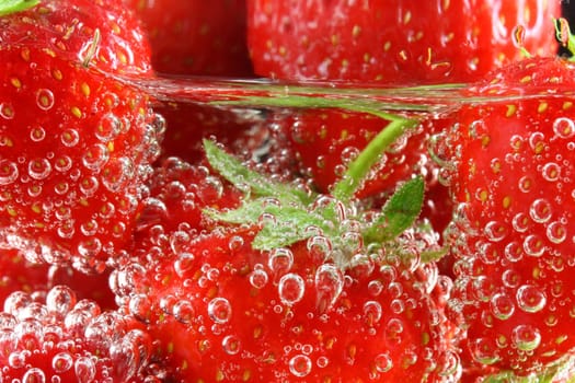 Strawberries in water close up
