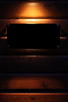 Spotlight on a black empty sign