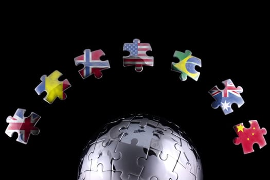 Jigsaw flags around a chrome globe