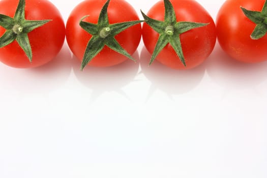 Vine tomatoes on top edge with copy space