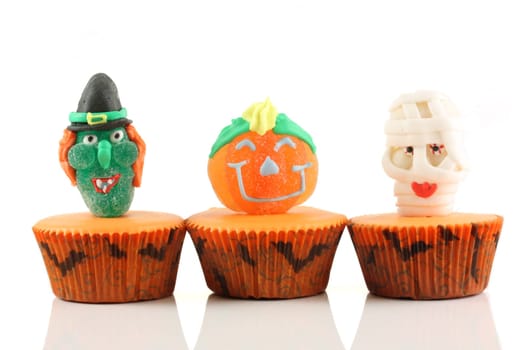 Spooks cup cakes on white background