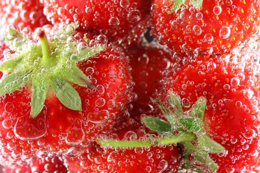 Strawberries in water close up