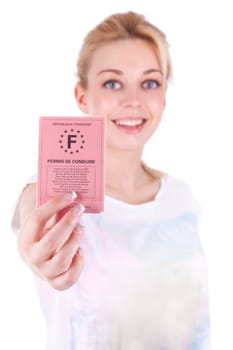 Happy caucasian teenage girl showing her driving license, isolated on white background - Caucasian people