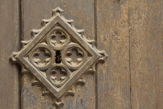 Old metal medieval door background. With a key lock on the left side
