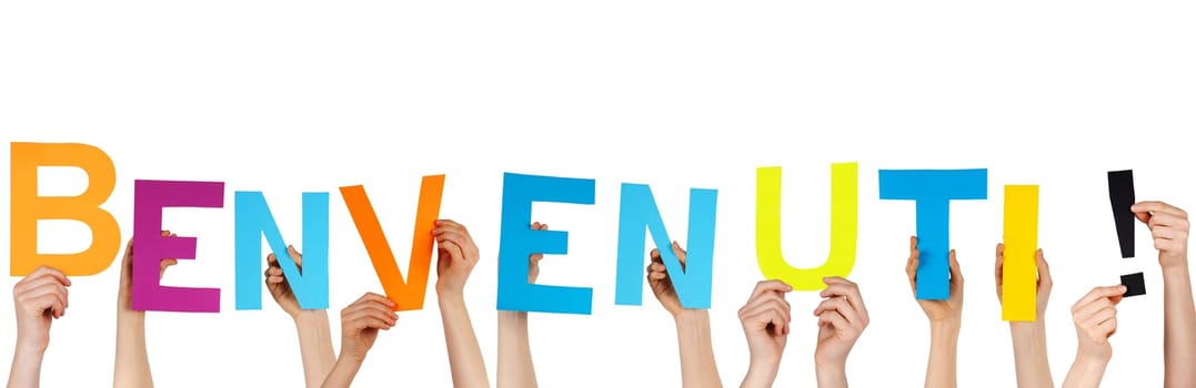 hands holding the italian word BENVENUTI! which meands welcome, isolated