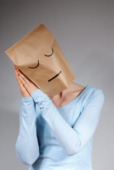 a person symbolizing tiredness, on gray background