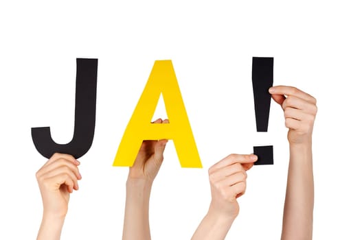 hands holding the german word JA! which means yes, isolated