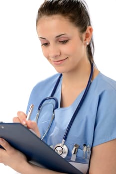 Smiling woman doctor writing on clipboard in blue uniform