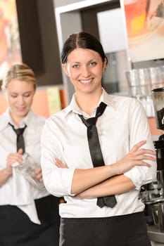 Confident waitress posing in cafe in uniform