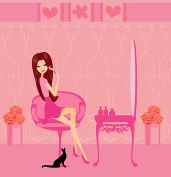 girl doing her makeup in the mirror at home