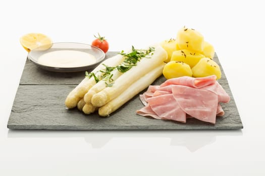 white asparagus with potato,ham and holandaise sauce