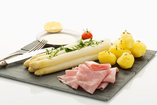 white asparagus with potato,ham and holandaise sauce