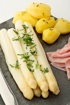 white asparagus with potato,ham and holandaise sauce