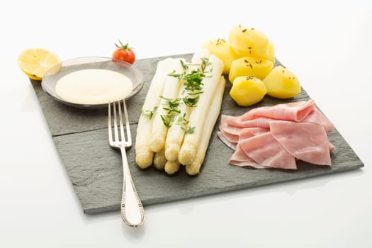 white asparagus with potato,ham and holandaise sauce