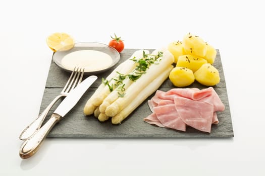 white asparagus with potato,ham and holandaise sauce