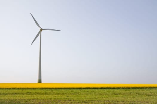Windmill over horizon line, alternatively energy source