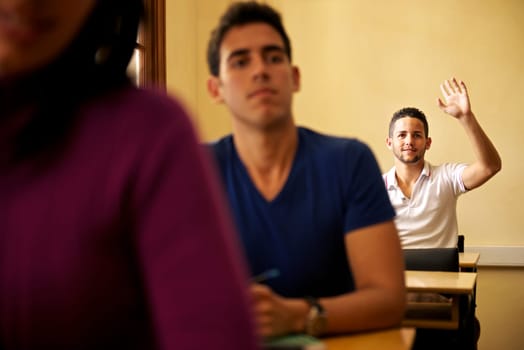 People at school, student raising hand and asking question to professor during class in college, Law School, University of Havana, Cuba