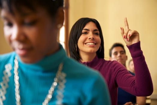 People at school, student raising hand and asking question to professor during class in college, Law School, University of Havana, Cuba