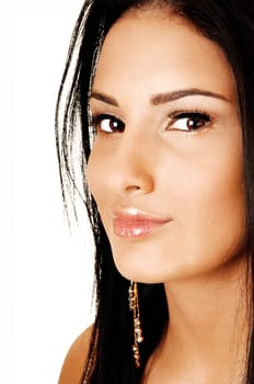 A young pretty teenager girl in a portrait shot with her long black hair, smiling, for white background.