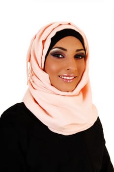 A young lovely teenager girl in a black jacket and a pink headscarf for white background, a portrait shoot of the girl smiling.