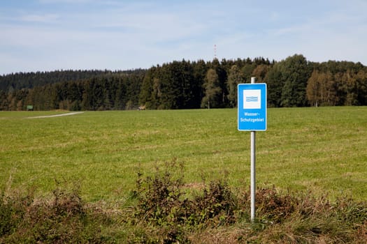 Water protection area with forest and meadow