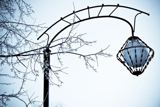 old style street lantern in the winter street