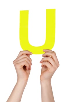 the letter U, hold by hands, isolated
