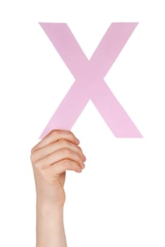 the letter X, hold by a hand, isolated